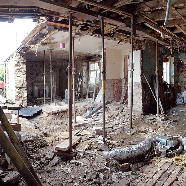 view from inside the cottage with the unsympathetic extension, and a lot of the internal walls, removed